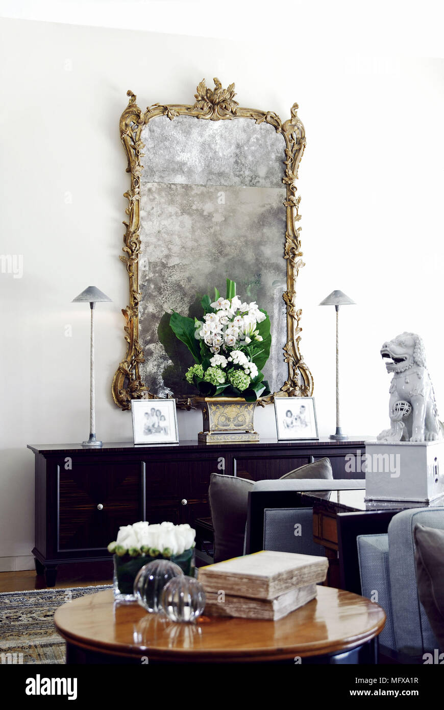 Pictureframe above sideboard in traditional style room Stock Photo