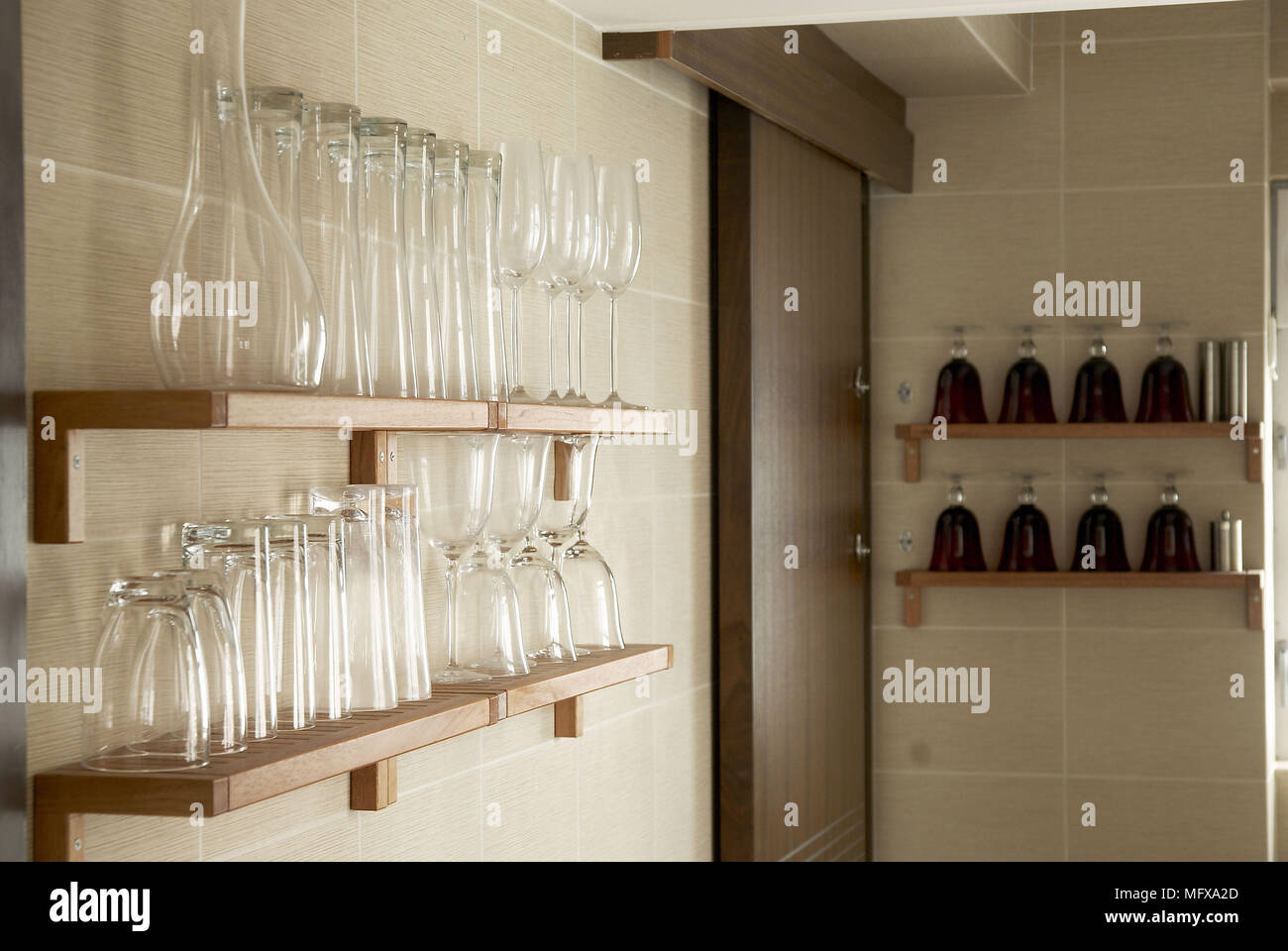 Drinking glasses on shelves Stock Photo