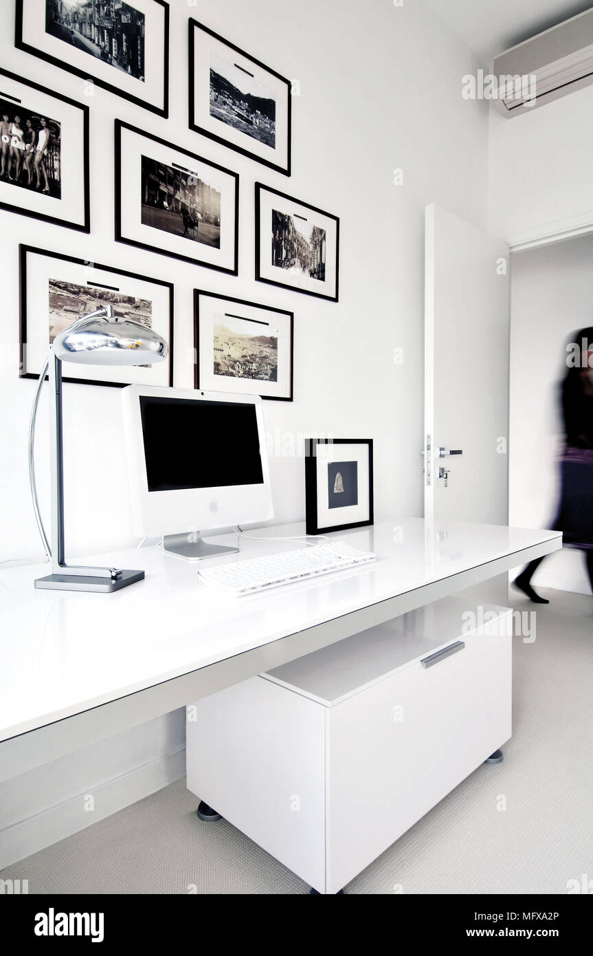 Computer on desk in modern home office Stock Photo