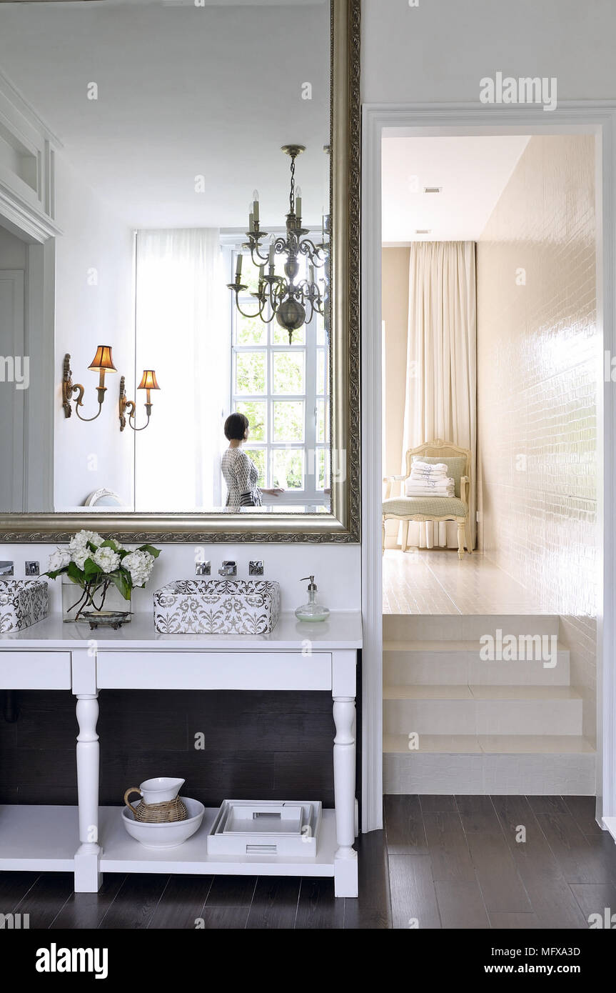 Owner seen reflected in mirror Stock Photo