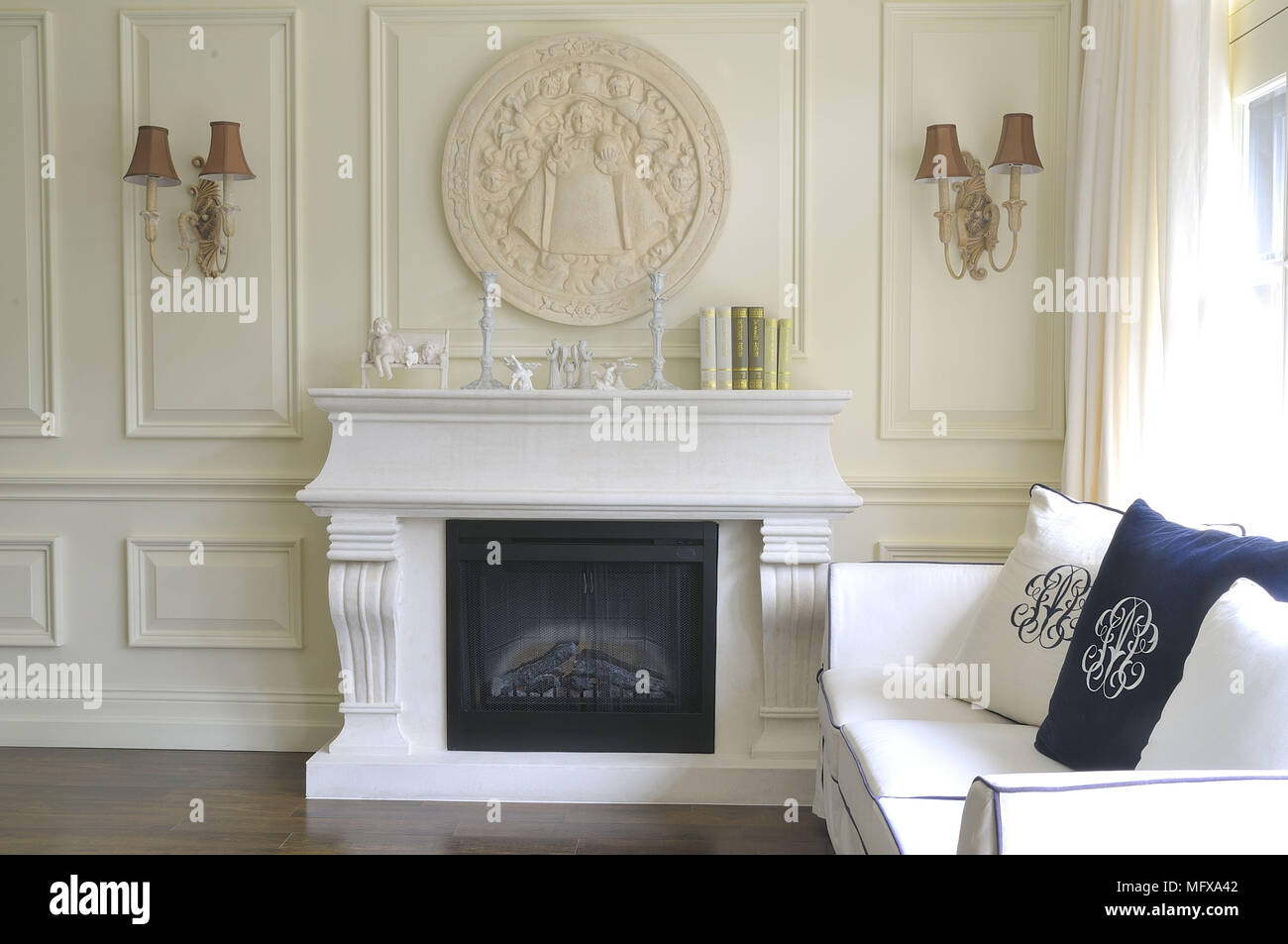 Upholstered sofa next to fireplace in traditional style sitting