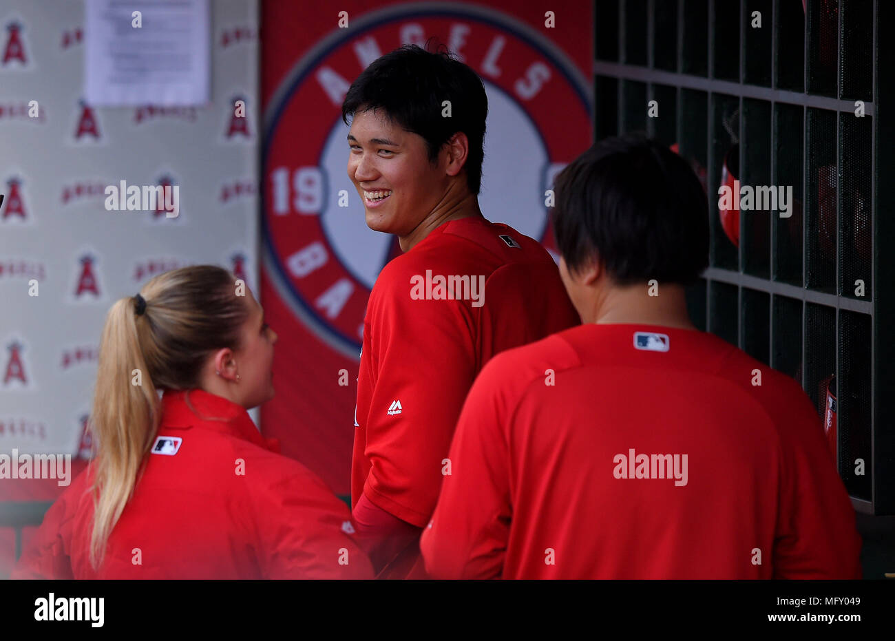 Los Angeles Angels designated hitter Shohei Ohtani smiles in the dugout ...