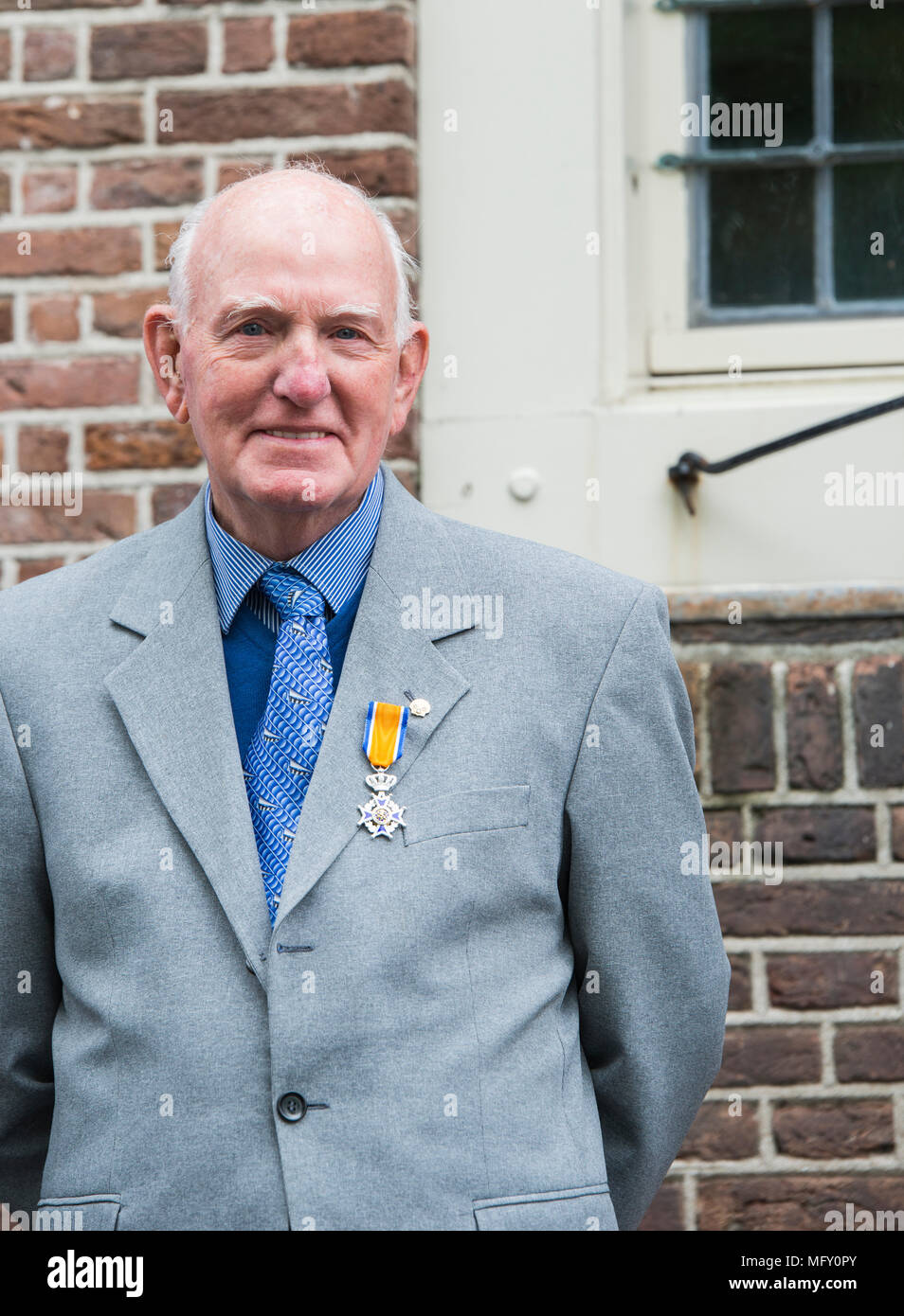 Hellevoetlsuis,Holland,27-April-2018: Mister Slavenburg with his decoration on the Order of ORange-Nassau,The National orders are granted based on recommendations from government commissions are given by the king on kingsday Credit: chris willemsen/Alamy Live News Stock Photo