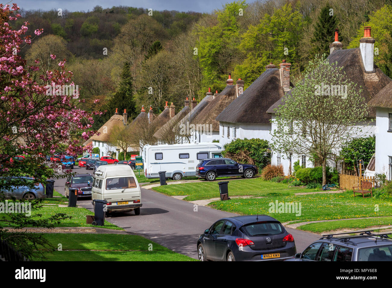 Beautiful village of Milton Abbas in Dorset, England, UK, GB with  traditional English thatched houses lining the street with grassed verges  Stock Photo - Alamy