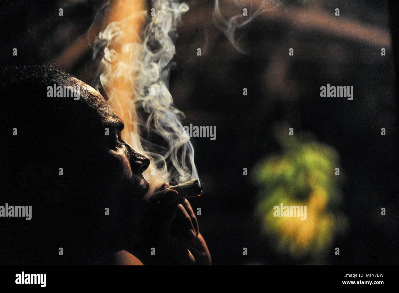local jamaican rastafarian rasta smoking smoke spiff marijuana  weed joint caribbean west indies jamaica Stock Photo