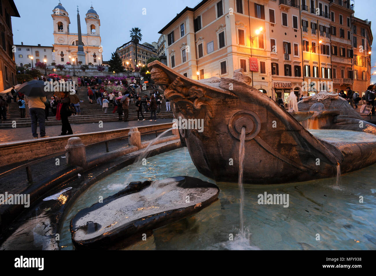 Early Baroque Fontana della Barcaccia (Fountain of the Old Boat) from XVII century on Piazza di Spagna, Keats–Shelley Memorial House on the right, mon Stock Photo