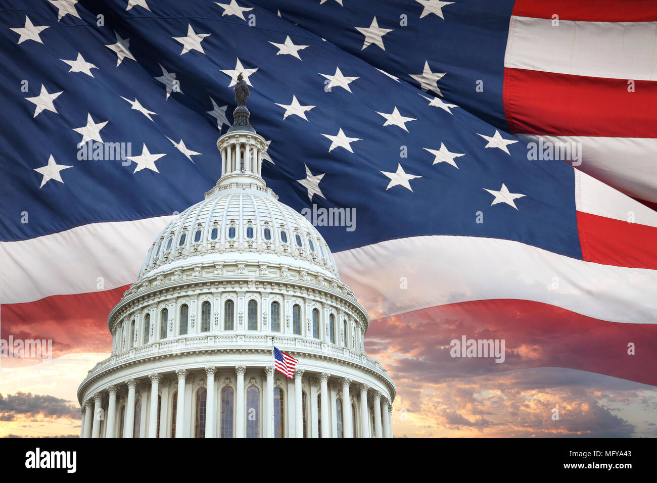 The dome of the United States capitol with an American flag and dramatic clouds behind Stock Photo