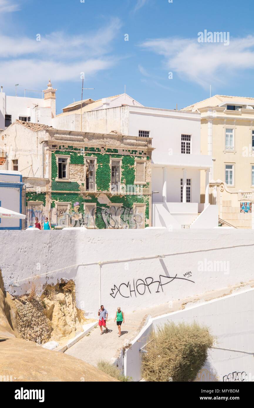 Traditional green tile covered old house on the streets of Albufeira