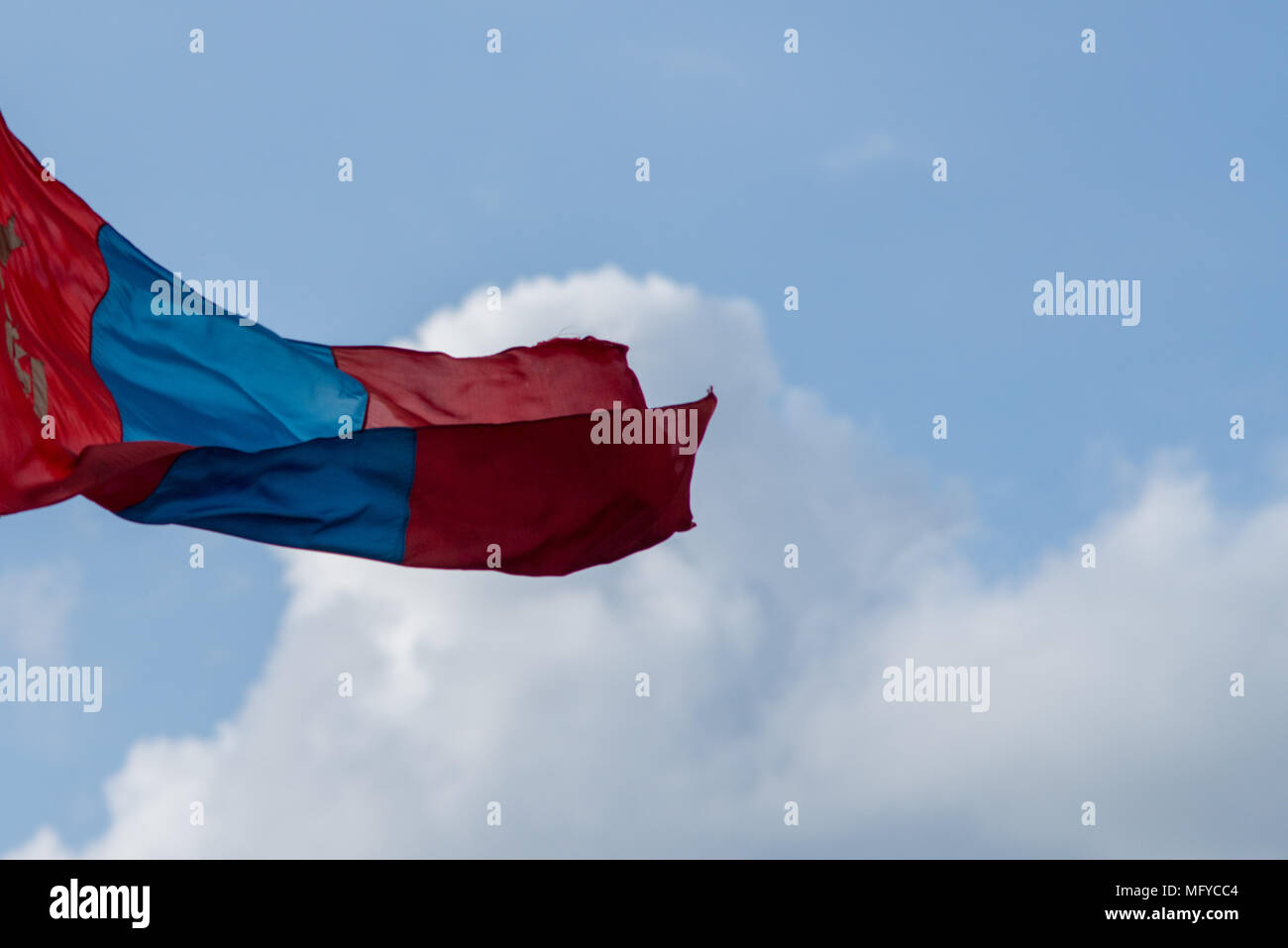 national flag of mongolia blowing in the wind with blue sky in ...