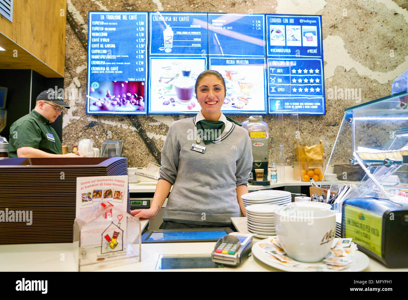 Mccafe Worker MILAN, ITALY - CIRCA NOVEMBER, 2017: worker at a McCafe coffee shop ...