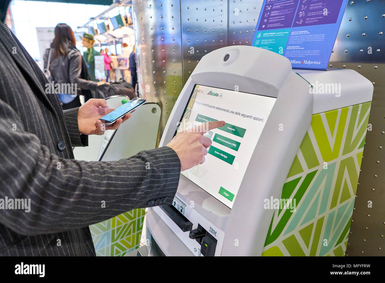 Milan Malpensa Italy Circa November 2017 A Passenger Use Alitalia Self Service Check In Kiosks At Milan Malpensa Airport Terminal 1 Stock Photo Alamy