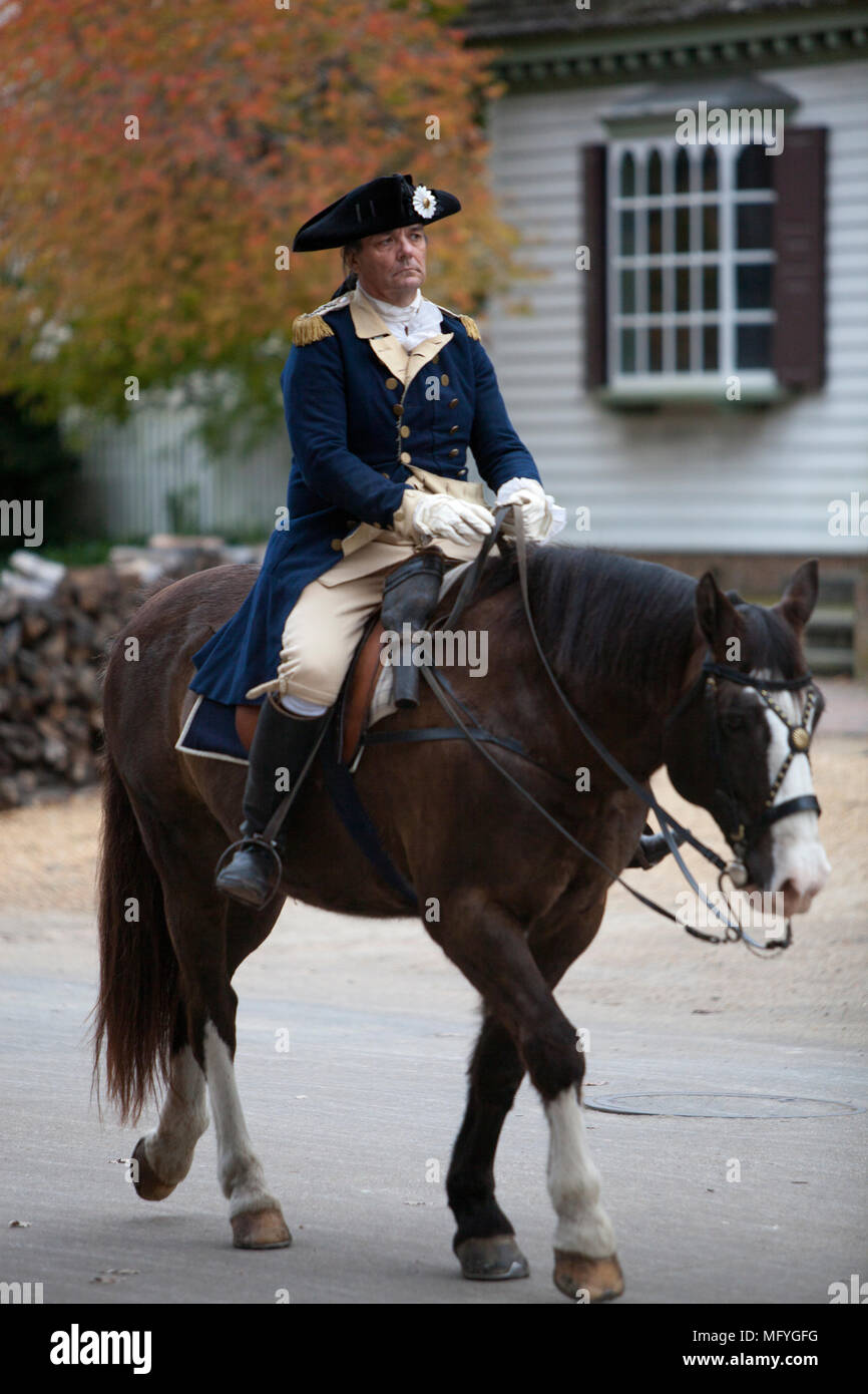 Actor portraying George Washington on horseback wearing military uniform riding down Duke of Gloucester Street colonial Williamsburg Virginia Stock Photo