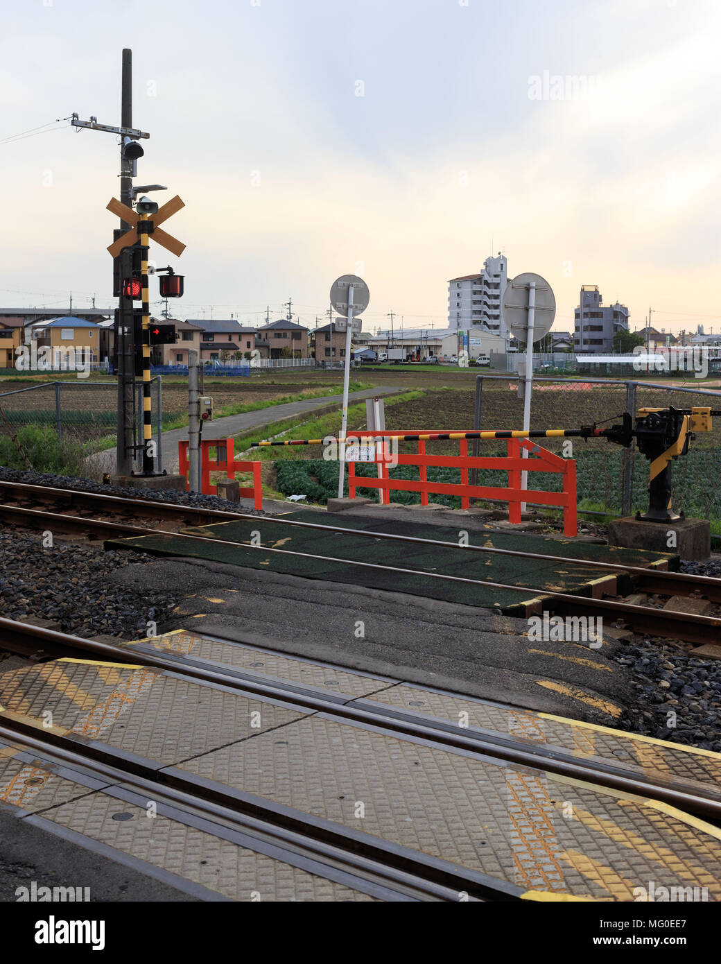 Japanese train crossing at a small town in the outskirts of Osaka