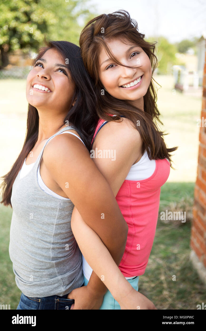 Sisters laughing and having fun outside. Stock Photo