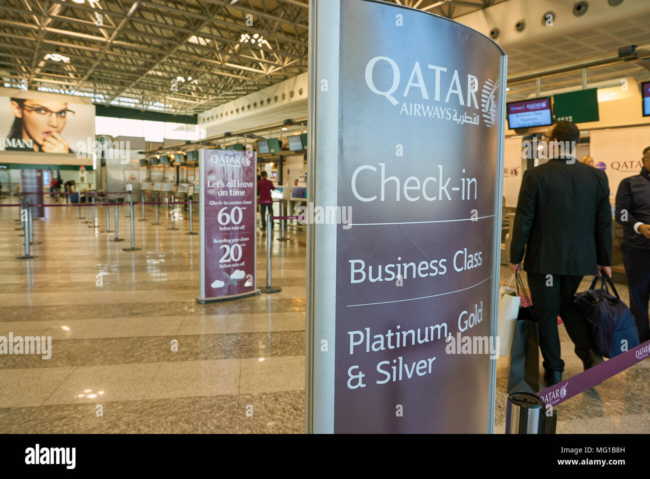 MILAN MALPENSA, ITALY - CIRCA NOVEMBER, 2017: Qatar Airways check-in area at Milan-Malpensa airport, Terminal 1. Stock Photo