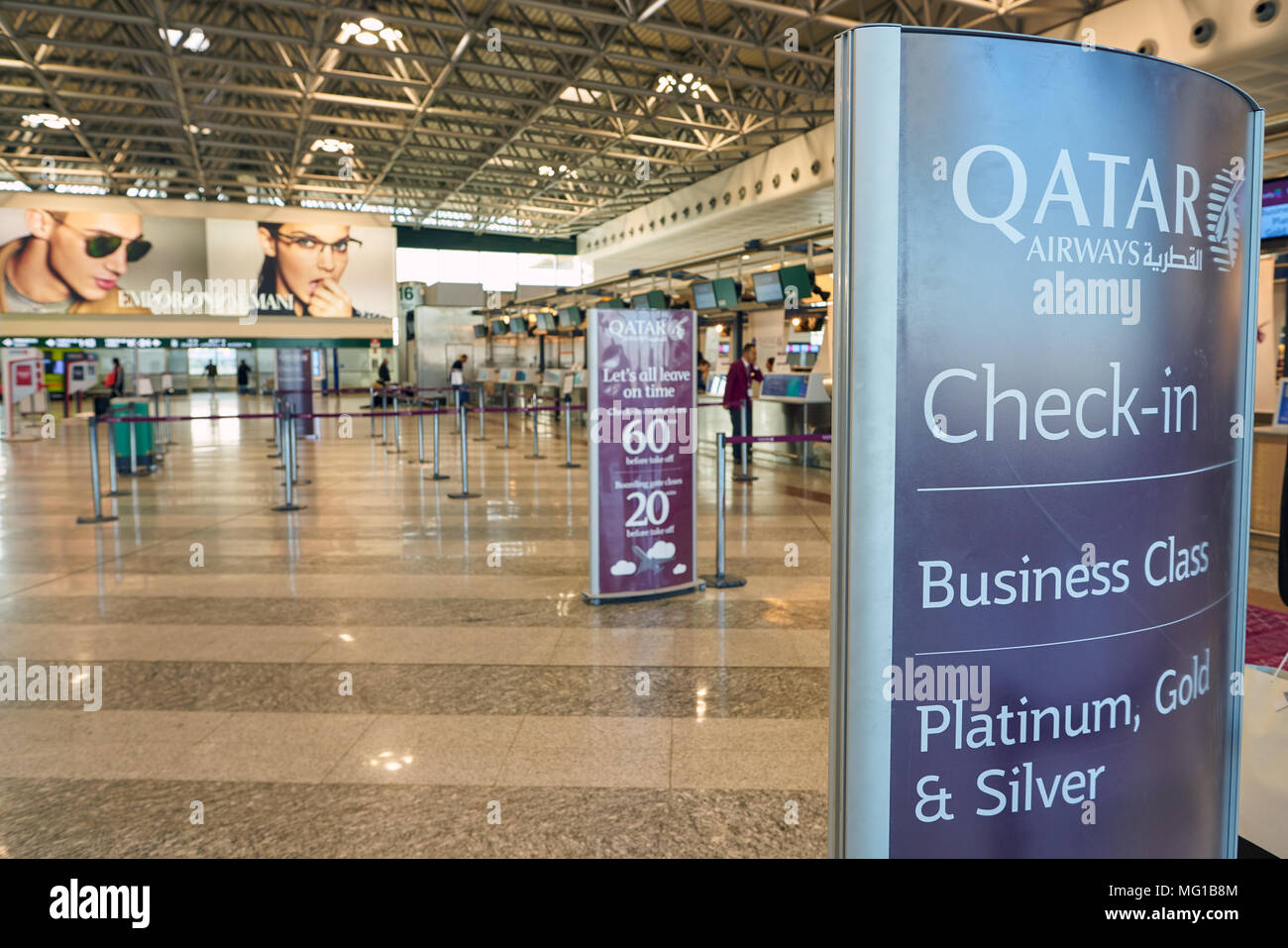 MILAN MALPENSA, ITALY - CIRCA NOVEMBER, 2017: Qatar Airways check-in area at Milan-Malpensa airport, Terminal 1. Stock Photo