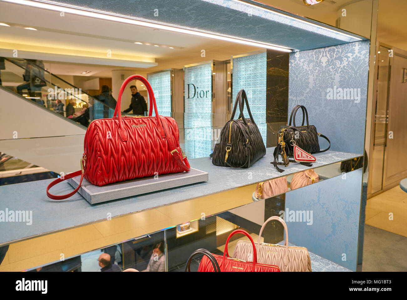 Milan, Italy - February, 25, 2022: woman wears pink Miu Miu Wander  Matelasse hobo bag in regenerated nylon Stock Photo - Alamy