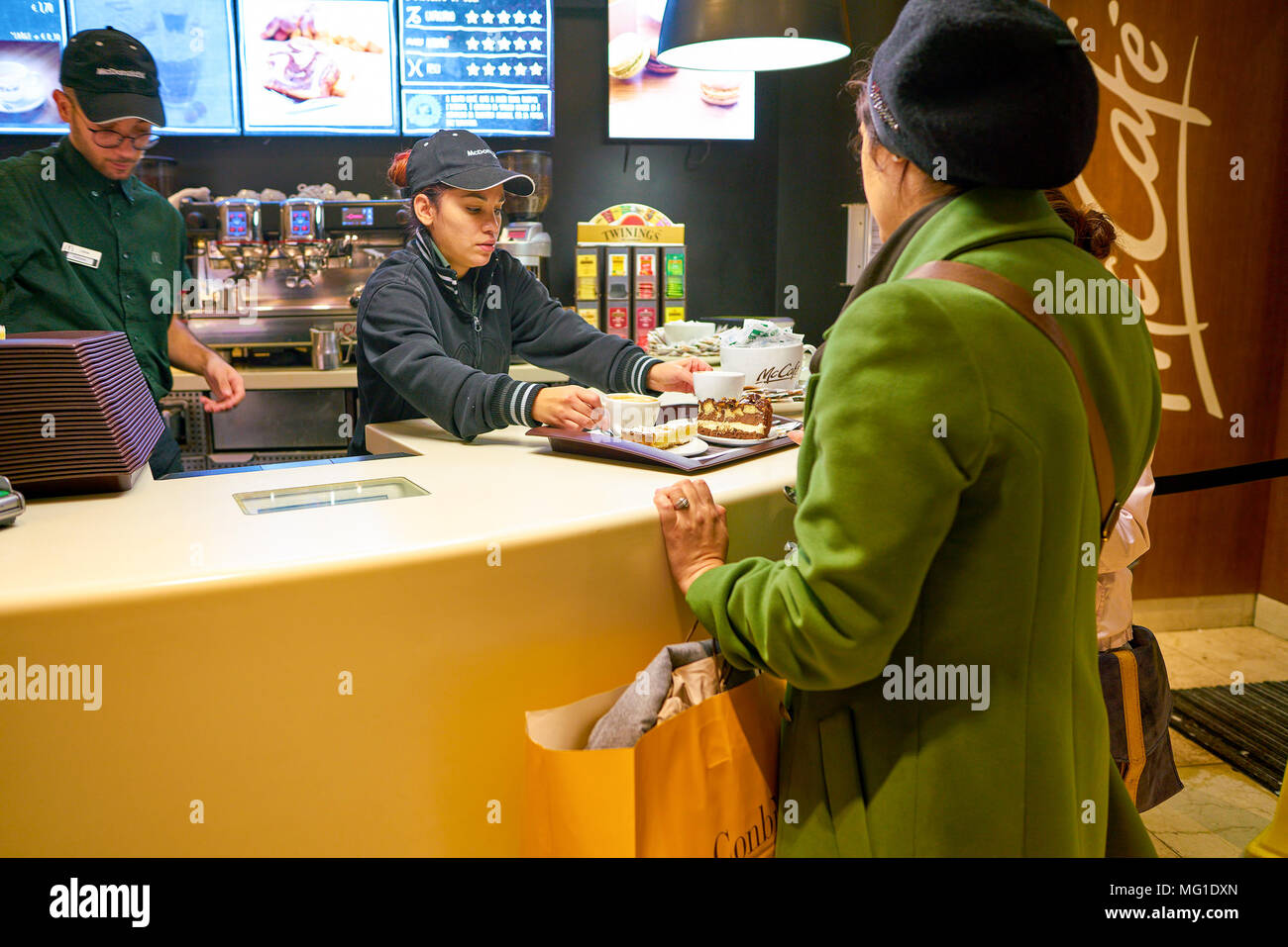 Mccafe Worker MILAN, ITALY - CIRCA NOVEMBER, 2017: worker at a McCafe coffee shop ...