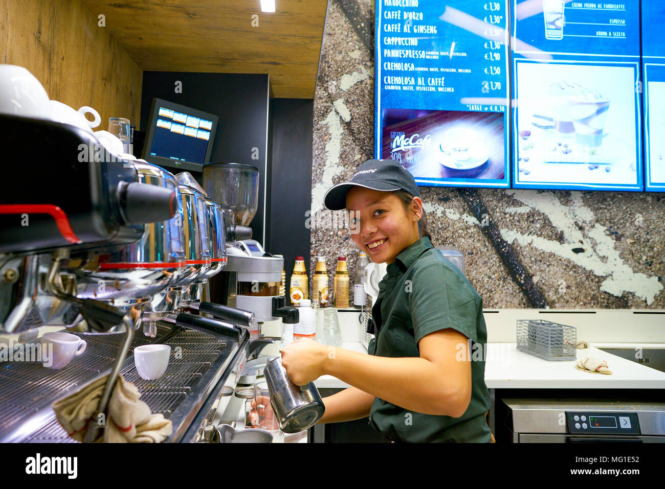 Mccafe Worker MILAN, ITALY - CIRCA NOVEMBER, 2017: worker at a McCafe coffee shop ...
