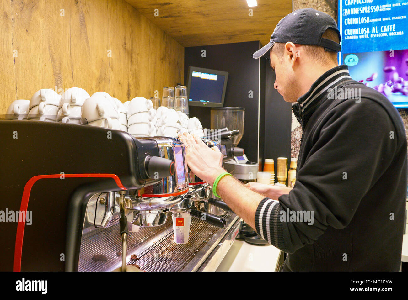 Mccafe Worker MILAN, ITALY - CIRCA NOVEMBER, 2017: worker at a McCafe coffee shop ...