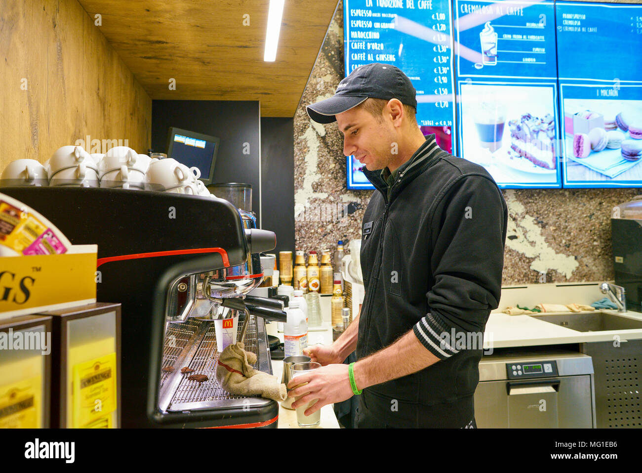 Mccafe Worker MILAN, ITALY - CIRCA NOVEMBER, 2017: worker at a McCafe coffee shop ...