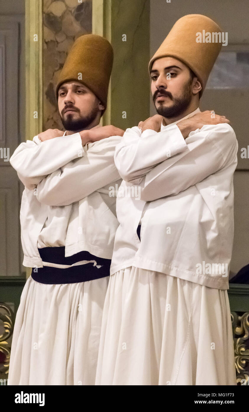 Sufi  (whirling dervish) disciples bow heads prior to dance in Istanbul, Turkey on Apr 30, 2016 Stock Photo