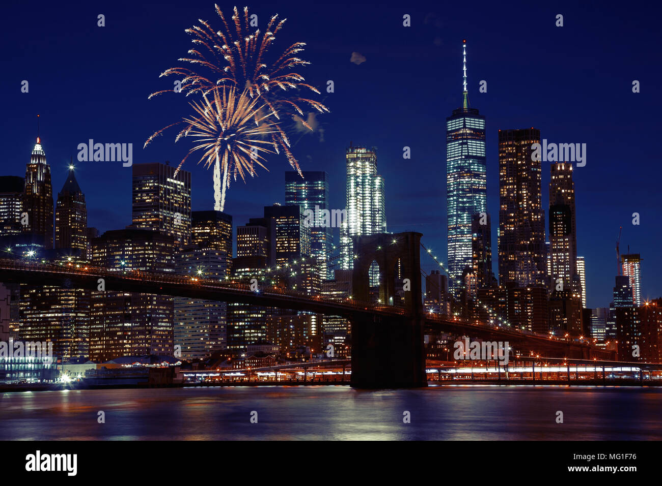 Fireworks over New York City skyline and Brooklyn Bridge Stock Photo ...