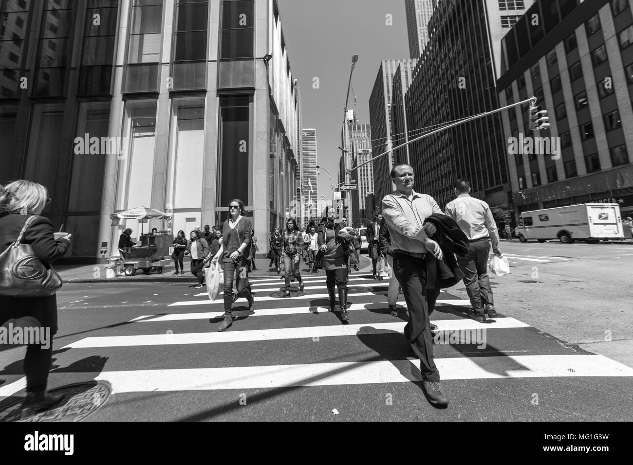 People in busy Cross Walk in New York City Stock Photo