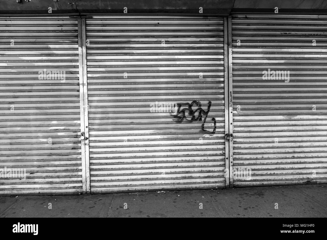 Black and white photo of a roll up door Stock Photo