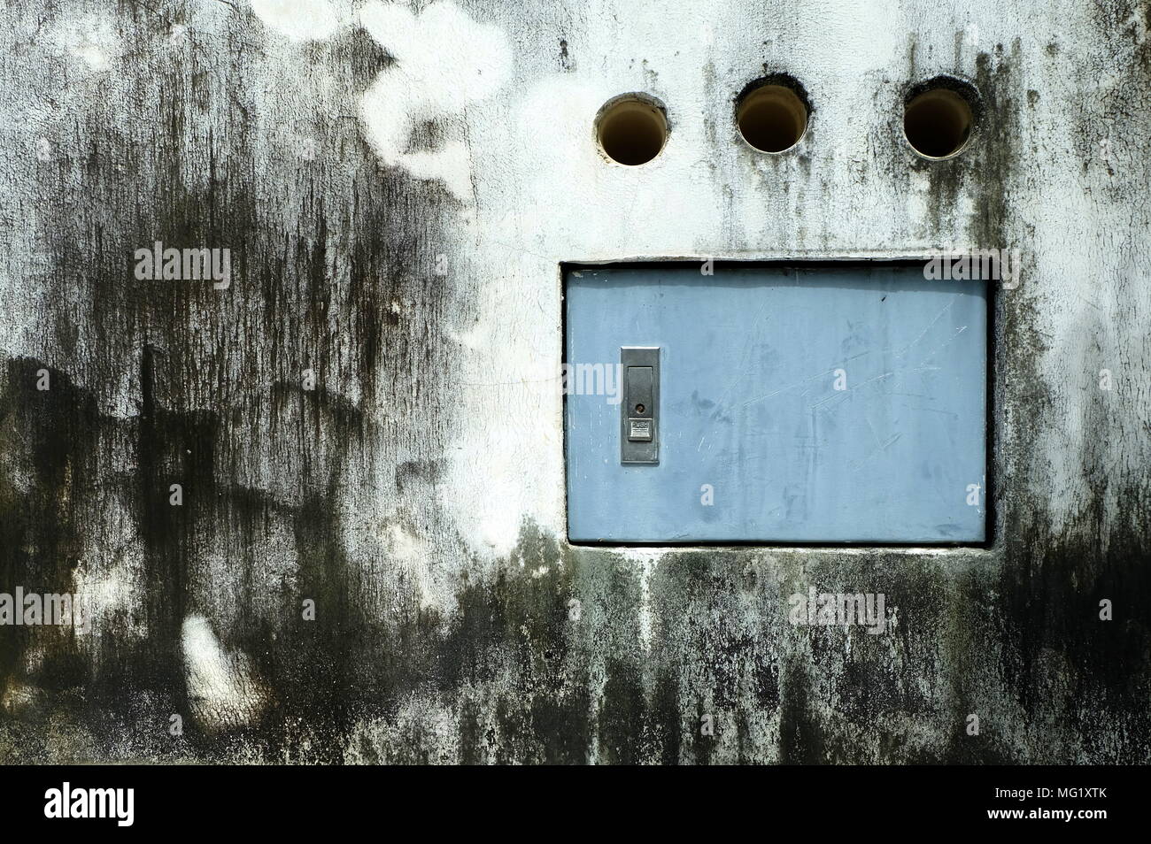 Electric Box on Old Grunge Concrete Wall. Stock Photo