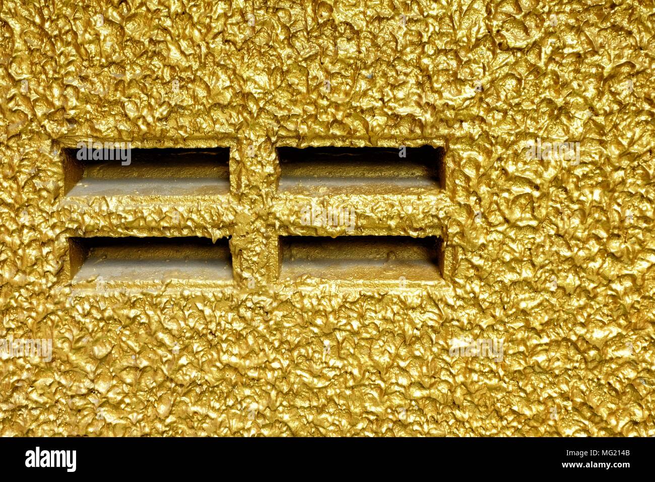 Outlet on Golden Painting Concrete Wall. Stock Photo