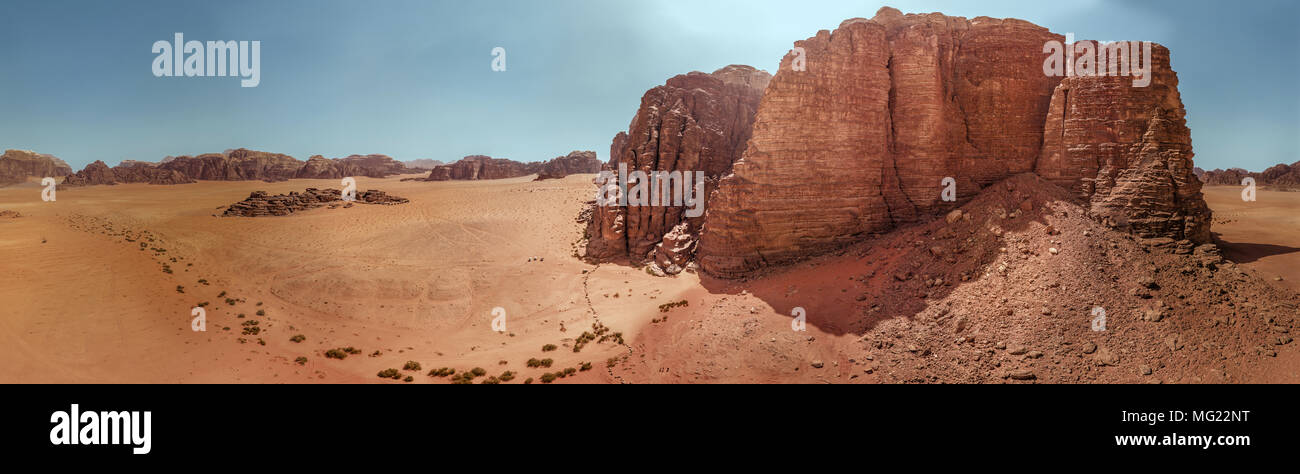 Aerial view of the gigantic rocks and mountains in the nature reserve of Wadi Rum, high resolution panorama, composed of single pictures, drone shot Stock Photo