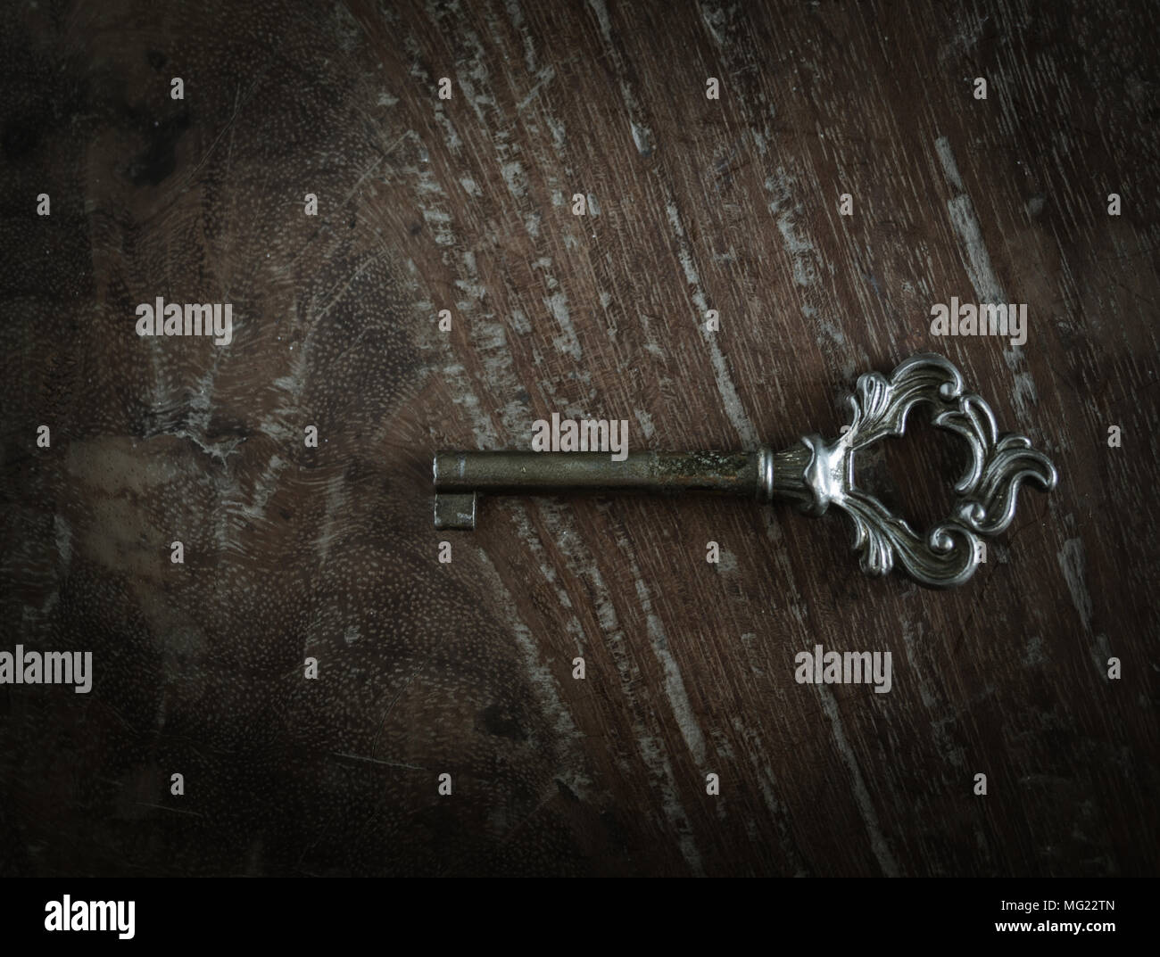 Classic Old Antique Key on Grunge Wooden Background Stock Photo - Alamy