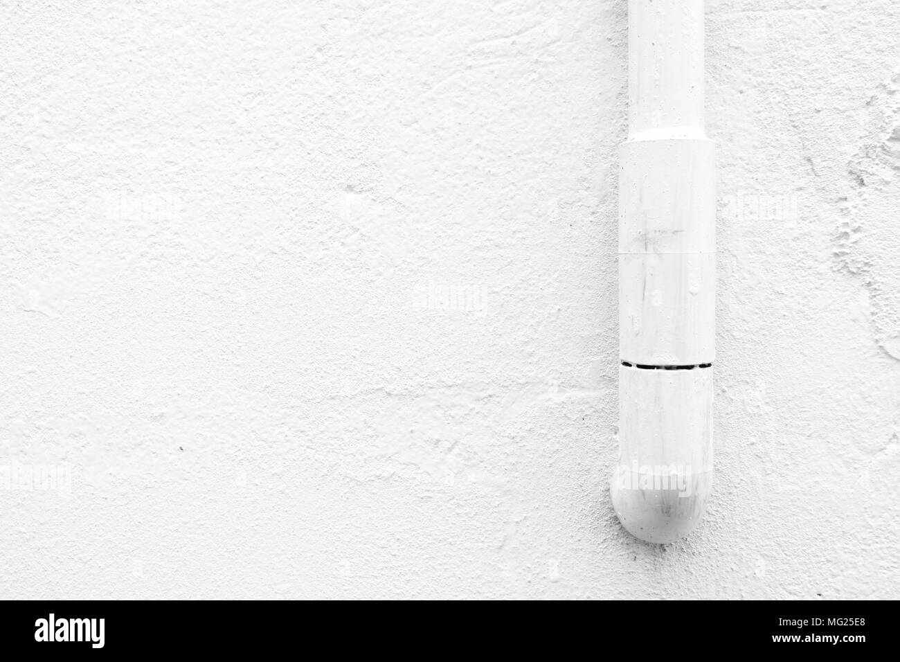 Water Pipe on White Grunge Concrete Wall Background with Space for Text. Stock Photo
