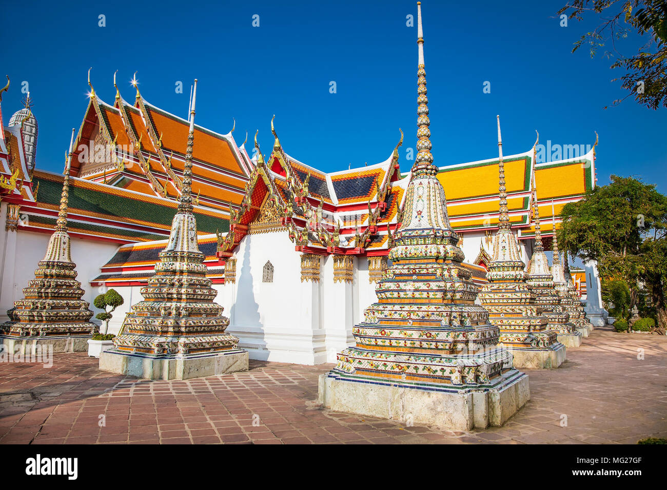 Wat Pho known also as the Temple of the Reclining Buddha is a royal temple of the first grade, one of ten such temples in Bangkok and 23 in Thailand. Stock Photo