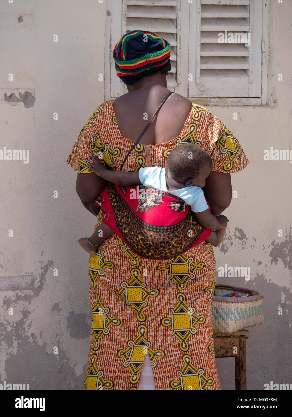 African Mother and baby in a back sling on the island of Sal Cape Verde Stock Photo