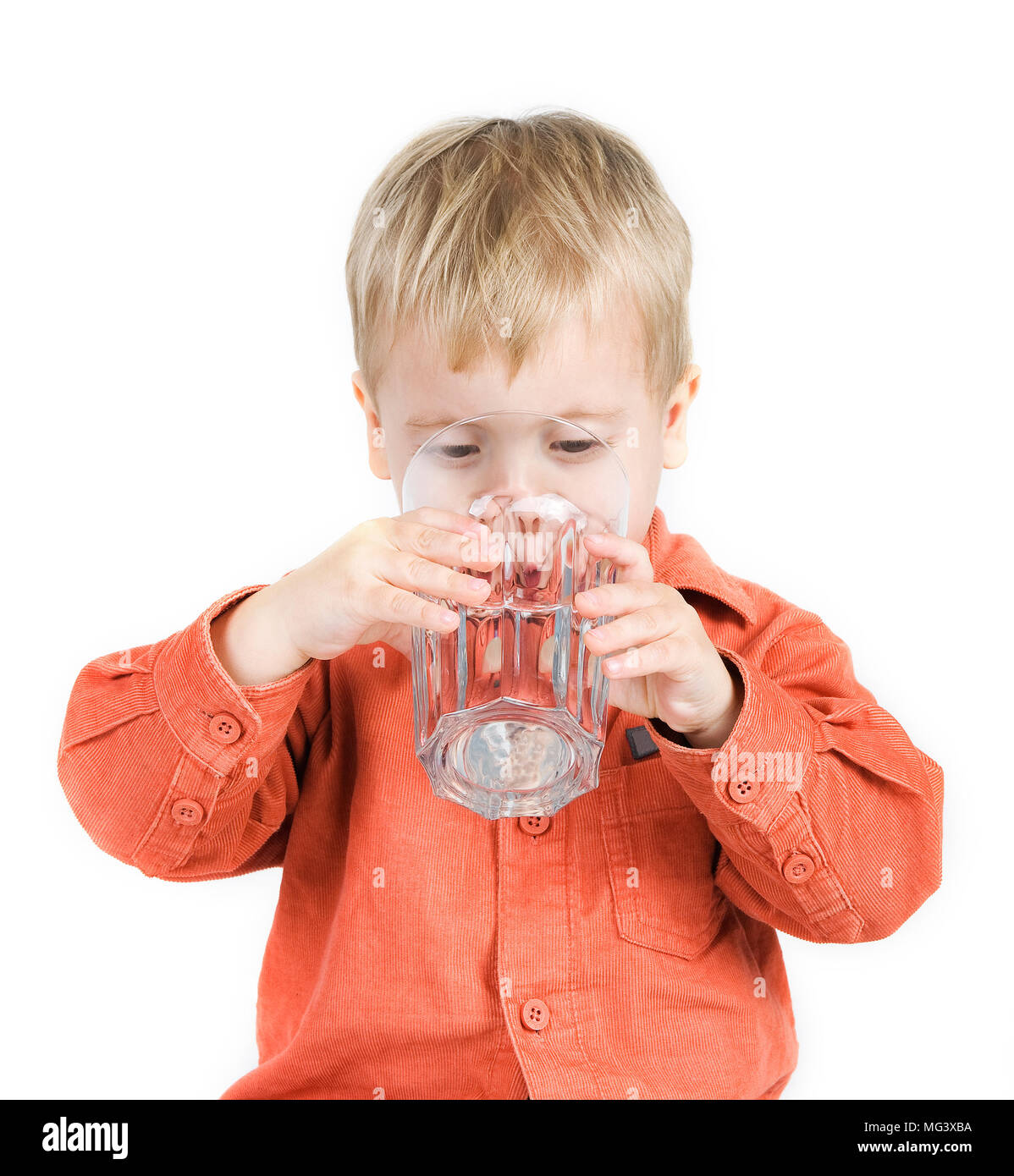 The boy drinks water from a glass Stock Photo Alamy