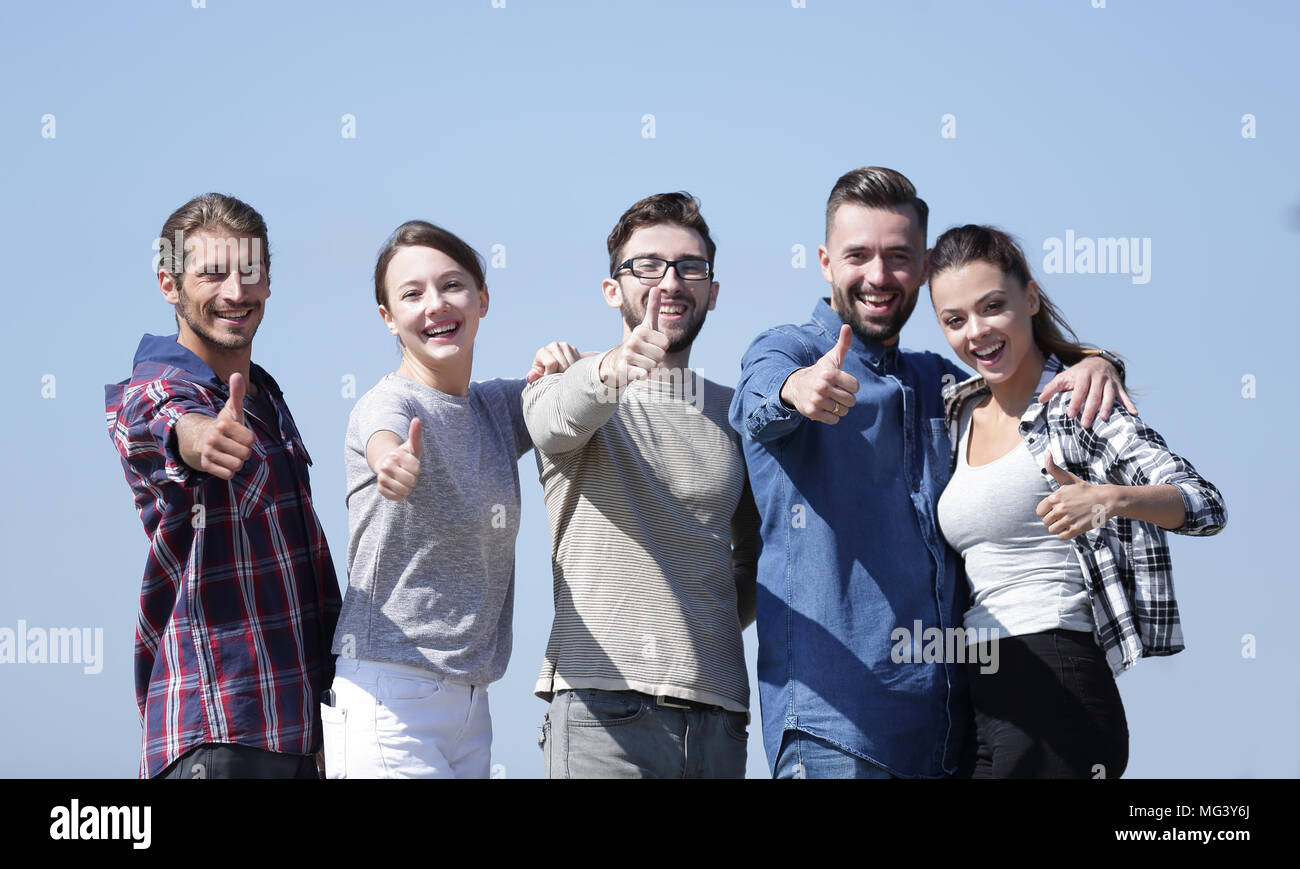 group of young people showing thumb up Stock Photo - Alamy