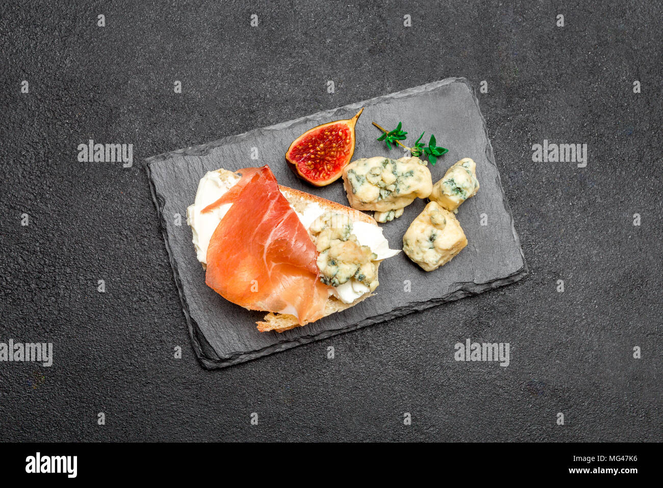 Bruschetta with ham, blue ceese and fresh figs Stock Photo