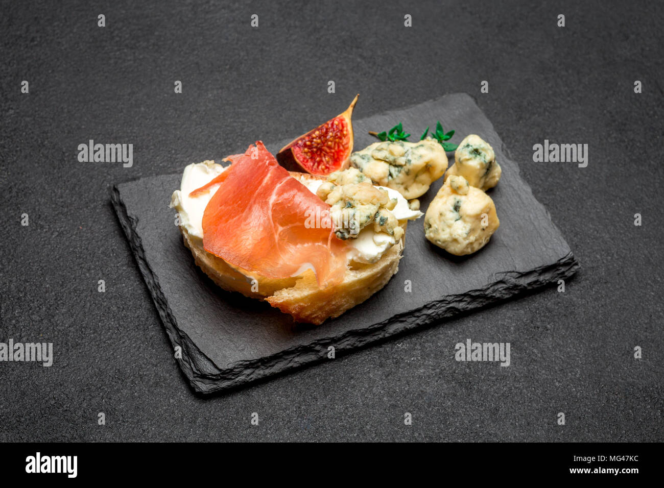 Bruschetta with ham, blue ceese and fresh figs Stock Photo