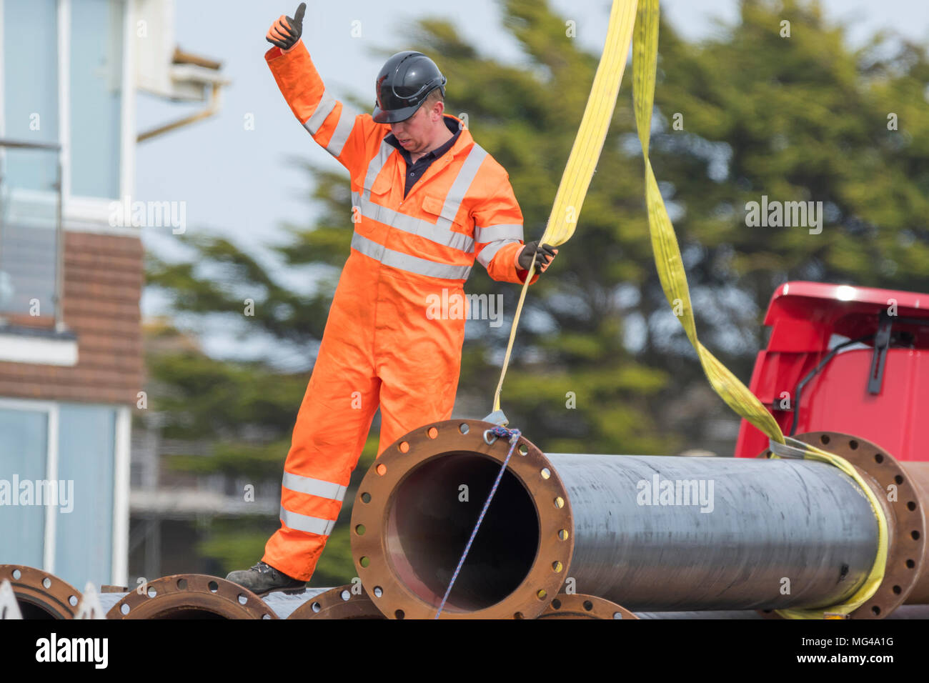 Lifting heavy pipework hires stock photography and images Alamy