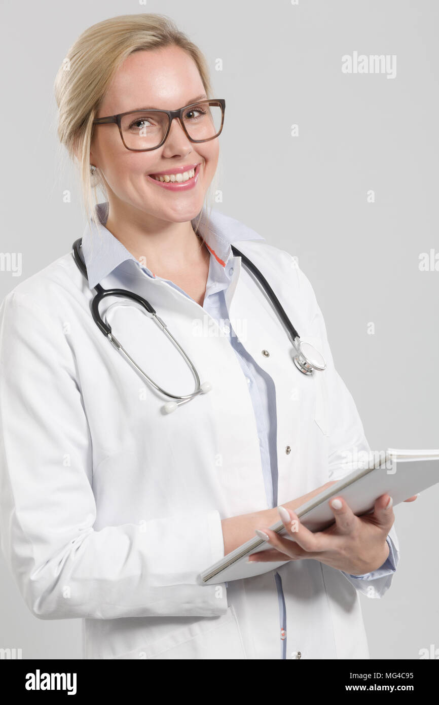 young female doctor with stethoscope and clipboard Stock Photo