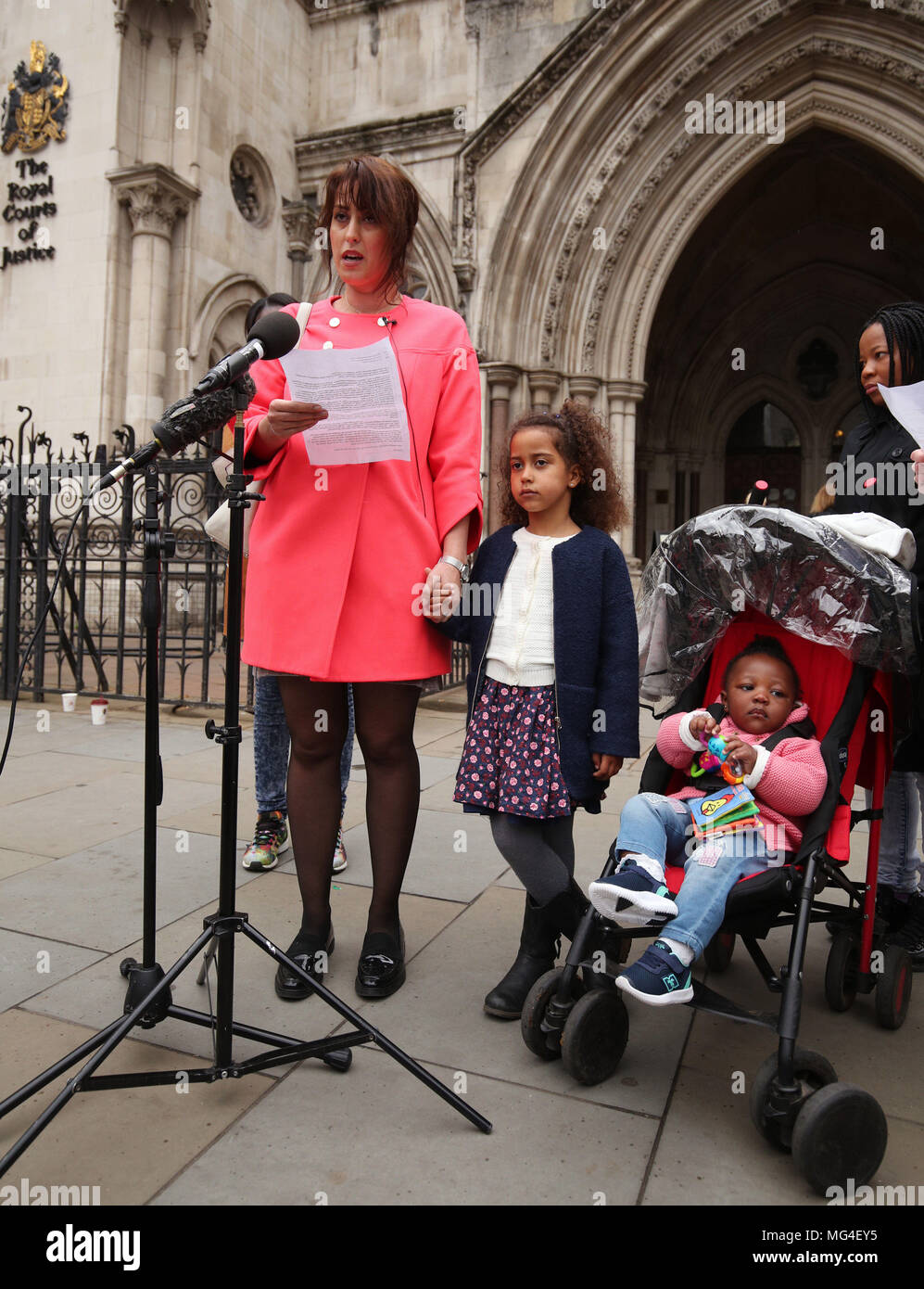 Alina Dulgheriu, 34, a representative for campaign group Be Here For Me, with her six-year-old daughter Sarah, speaks to the media outside the Royal Courts of Justice in London, after filing a High Court challenge against Ealing council over a ban on protesting outside a Marie Stopes clinic. Stock Photo