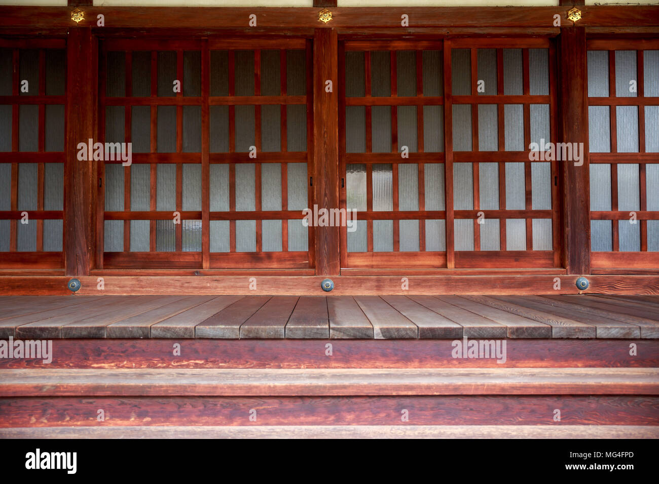 Sliding Wood And Glass Doors At The Main Entrance To A