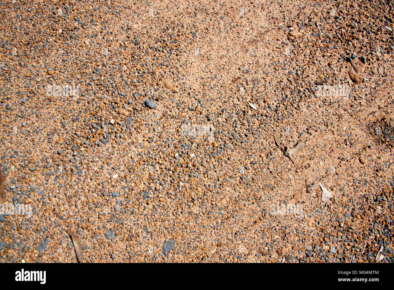 Brown Gravel texture and small stone background. Sand and stones on the floor. The land is covered with stones Stock Photo
