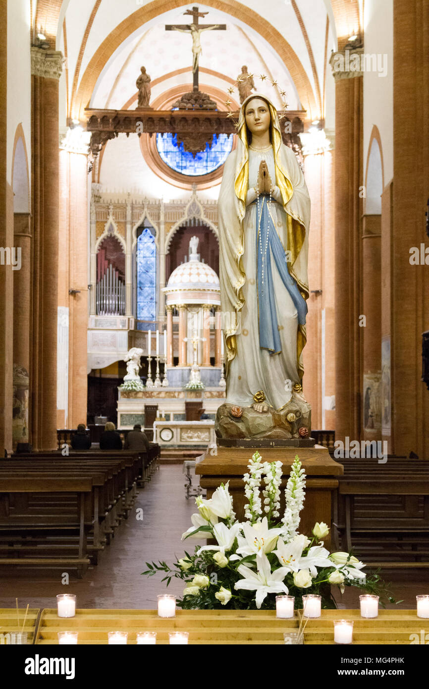 A statue of Our Lady of Lourdes in the 'Santa Maria del Carmine' church (Holy Mary of Carmel) in Pavia, Italy. - Stock Image