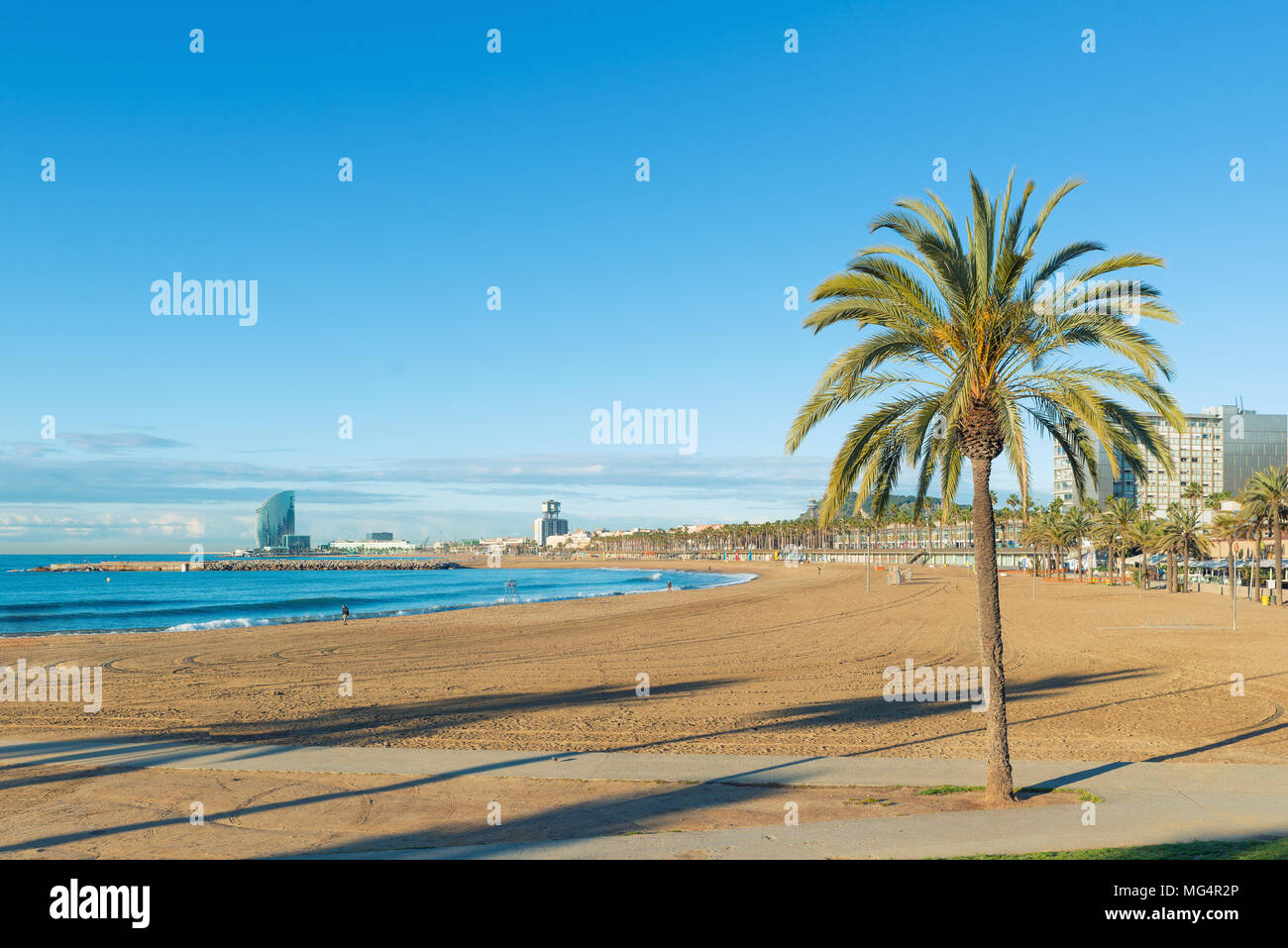 Barceloneta Beach in Barcelona with colorful sky at sunrise. Seafront, beach,coast in Spain. Suburb of Barcelona, Catalonia Stock Photo