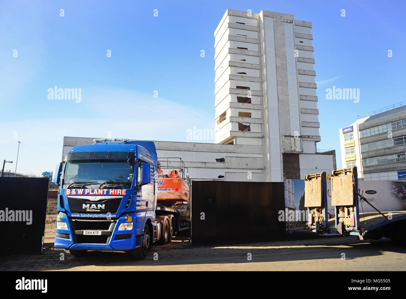 heavy goods vehice delivering plant machinery to building site leeds yorkshire united kingdom Stock Photo