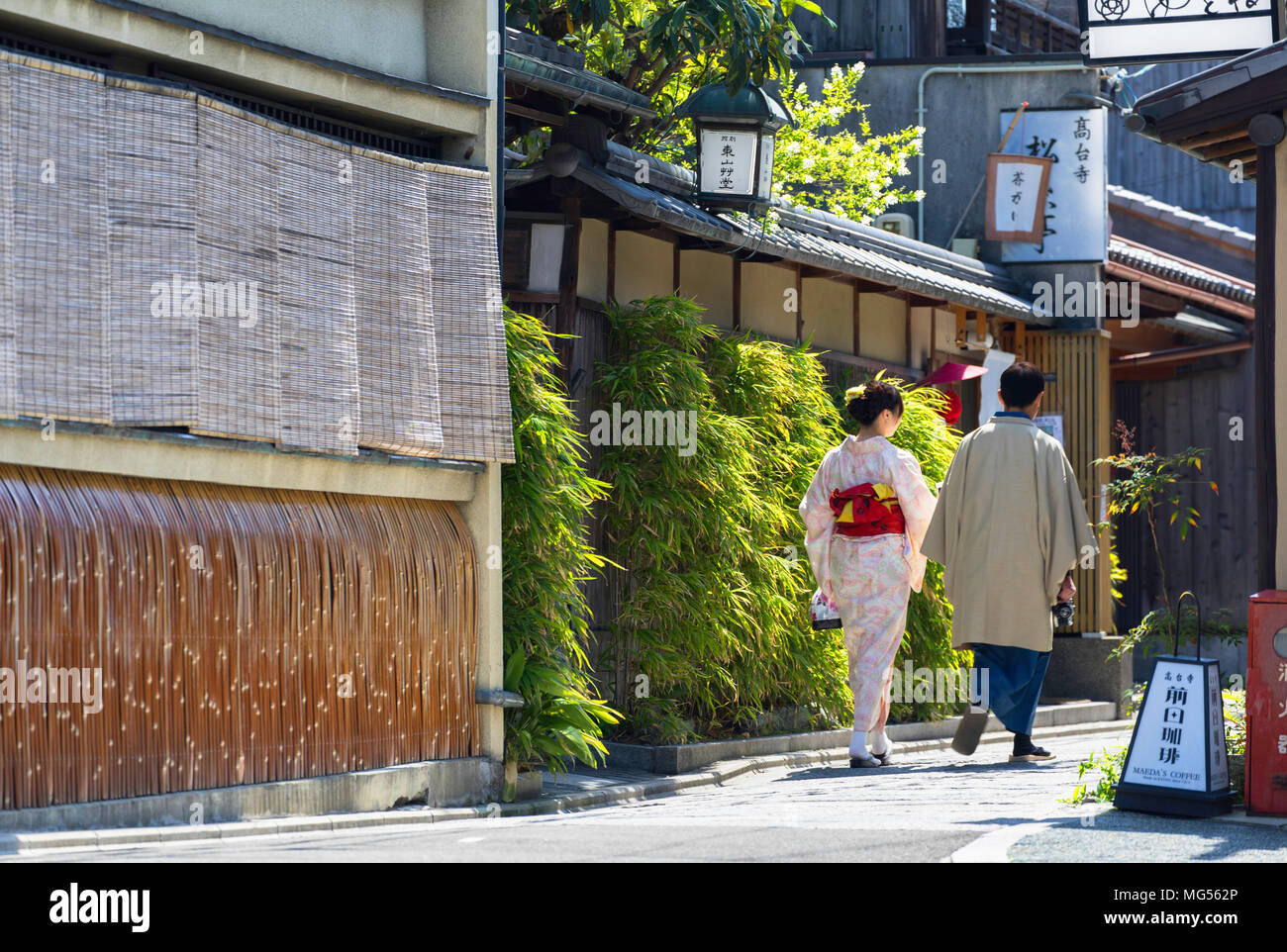 Couple in kimonos walking along lane of Southern Higashiyama, Kyoto, Kansai, Japan Stock Photo