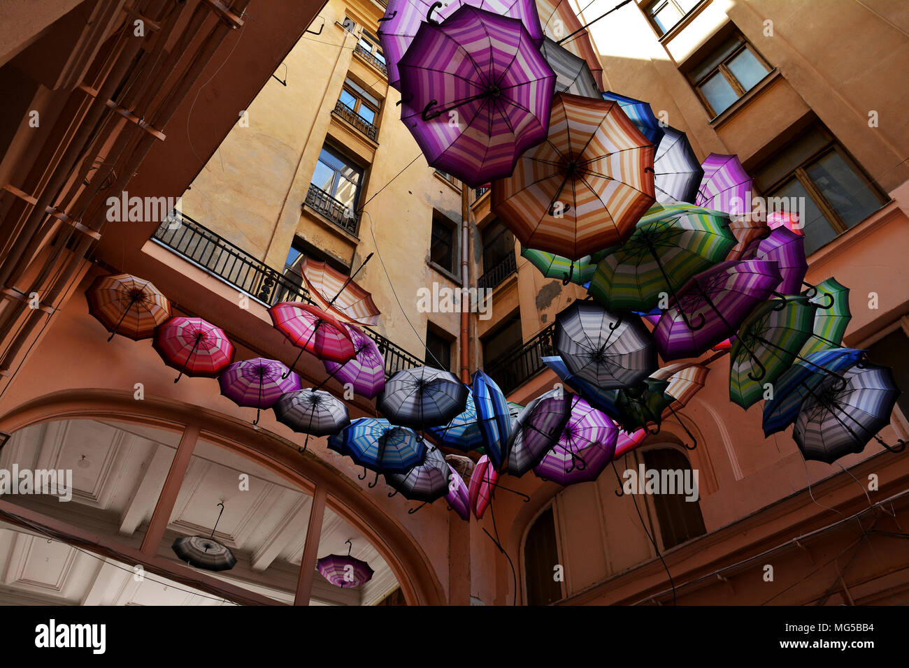 Rainbow umbrellas roof street in Victory Passage , Bucharest, Romania